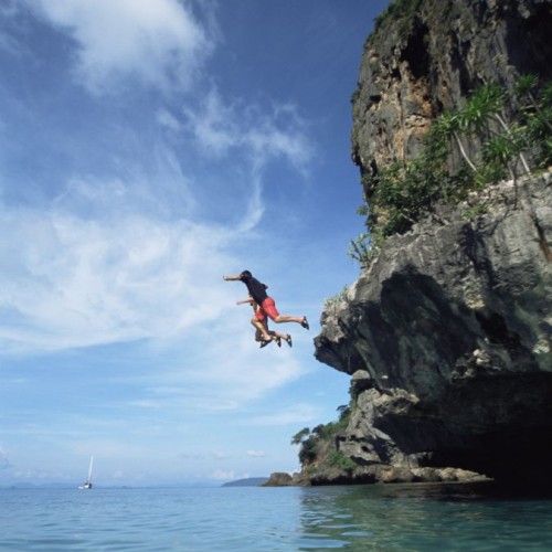 Jumping off cliff into the sea water © Monkey Business Images | Dreamstime 6078541