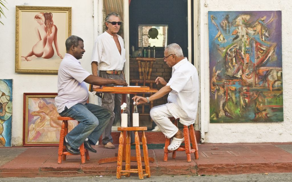 Locals playing dominos in Santo Domingo, Dominican Republic © Dlrz4114 | Dreamstime